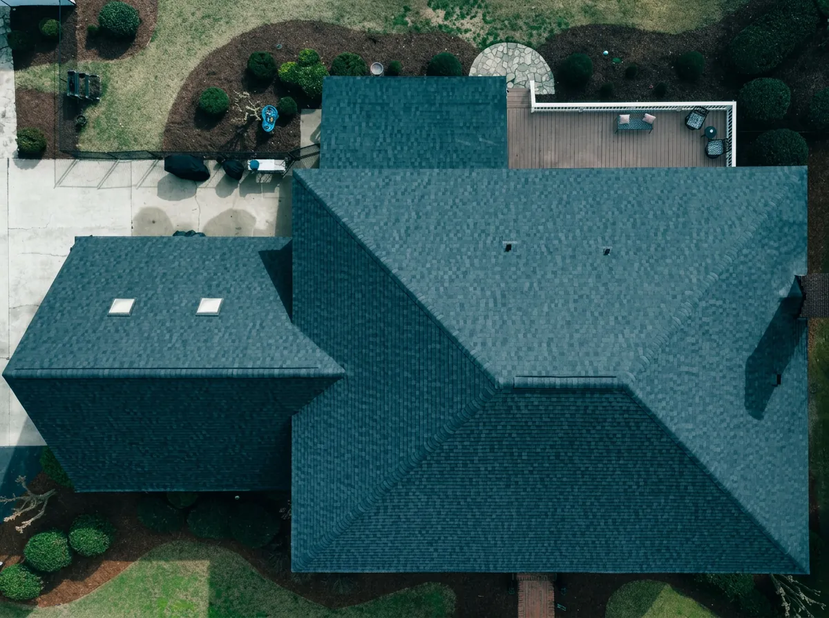 Top-down aerial view of a completed charcoal hip roof — roofing near Goldsboro, NC