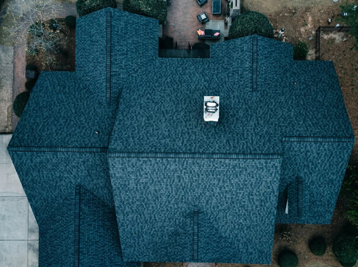 Top-down aerial view of a large completed charcoal shingle roof