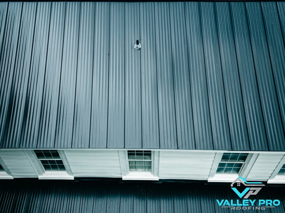Aerial view of a completed charcoal standing-seam metal roof — roofing near Selma, NC
