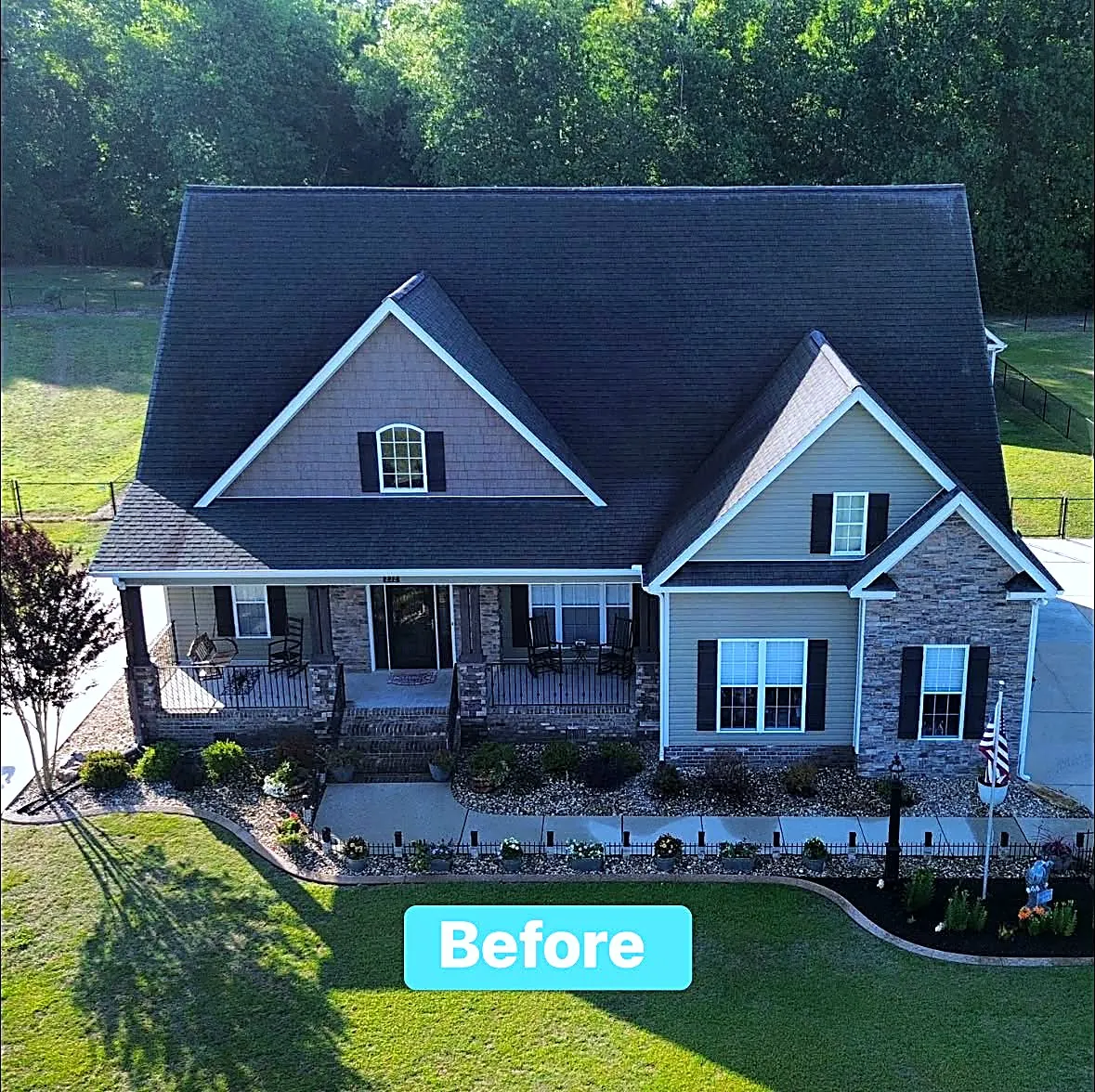Aerial before photo of a Craftsman home with an aging dark shingle roof