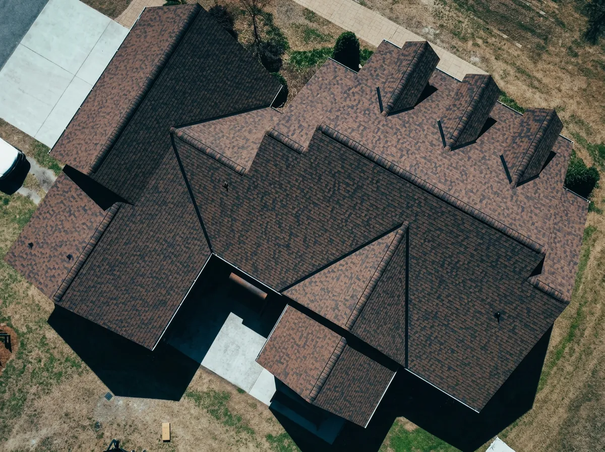 Top-down aerial view of a large brown architectural shingle hip roof — roofing near Selma, NC